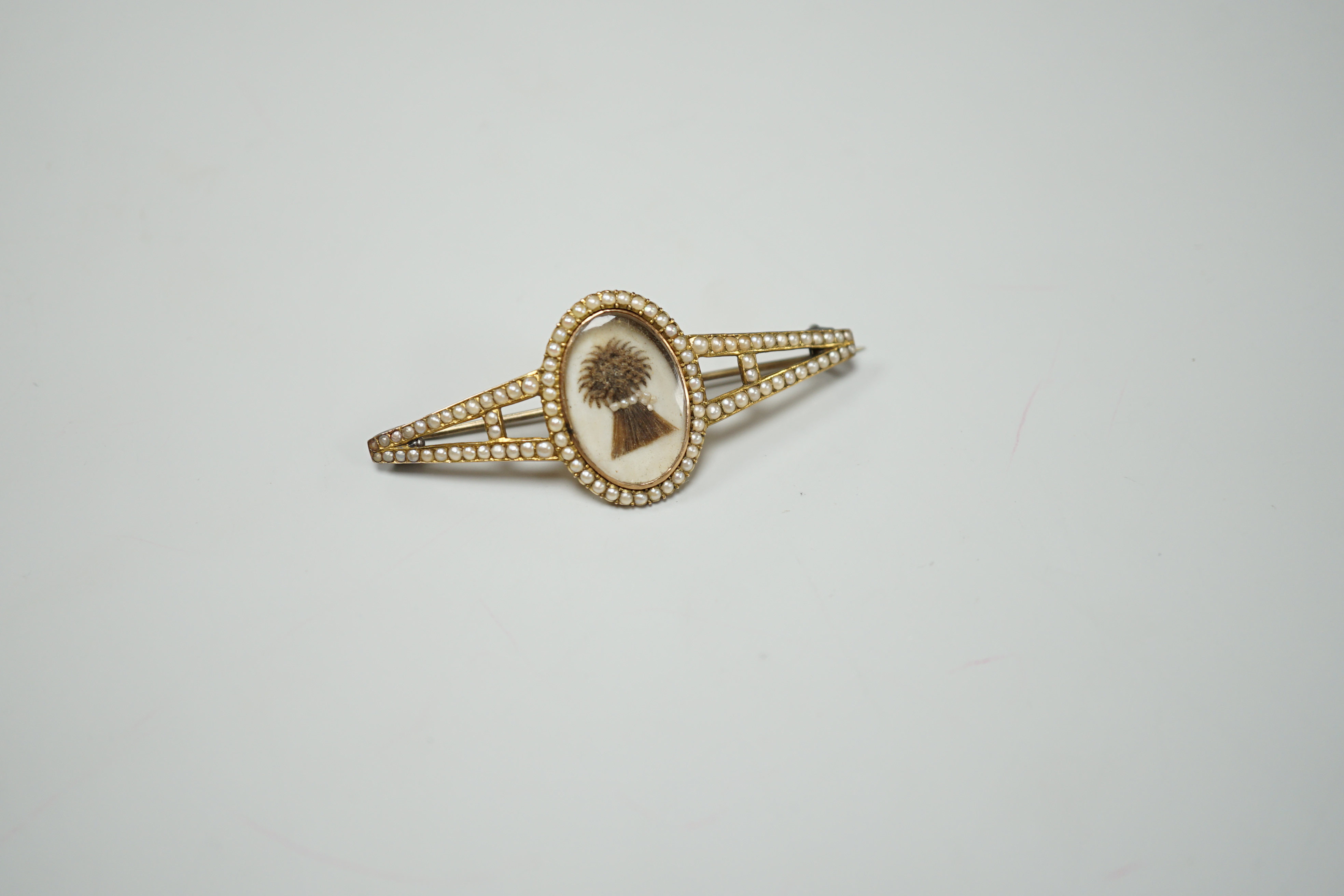 A Regency split pearl set gold brooch, inset with a hairwork bushel of wheat, 5.25cm